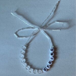 Taylor Swift invisble string bracelet